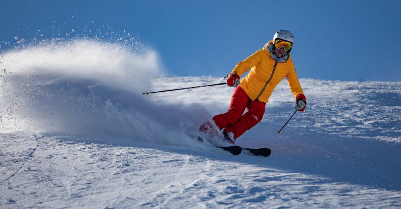 Winter Sport - Person in Yellow Jacket and Red Riding on Snow Ski