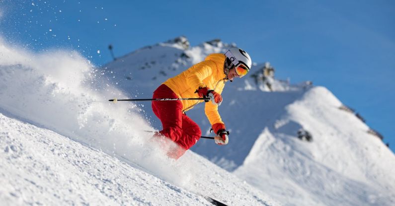 Winter Sport - Person in Yellow Jacket and Red Pants Skiing
