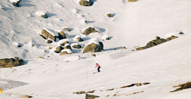 Winter Sport - Skier Riding on an Alpine Slope
