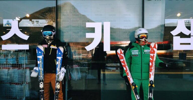 Cross-Country Skiing - Two skiers standing in front of a store with skis