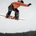 Snowboard - Man in Snowboard Jumping on Ramp