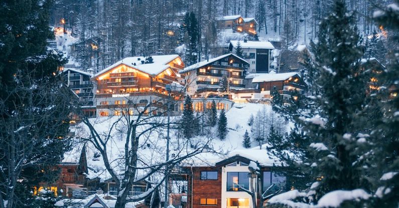 Snow Resort - Winter resort houses located on forested snowy hilly terrain