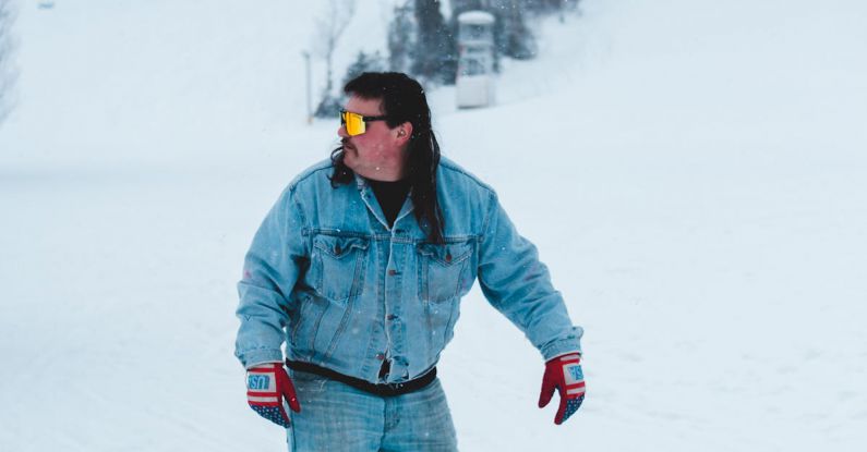 Ski Trip - Stylish skier in glasses on snowy slope