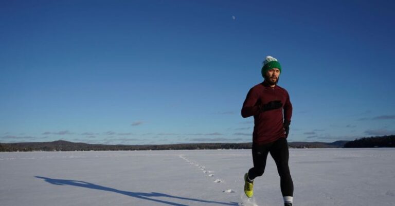 Winter Sport - Man Running on Ice Covered Land
