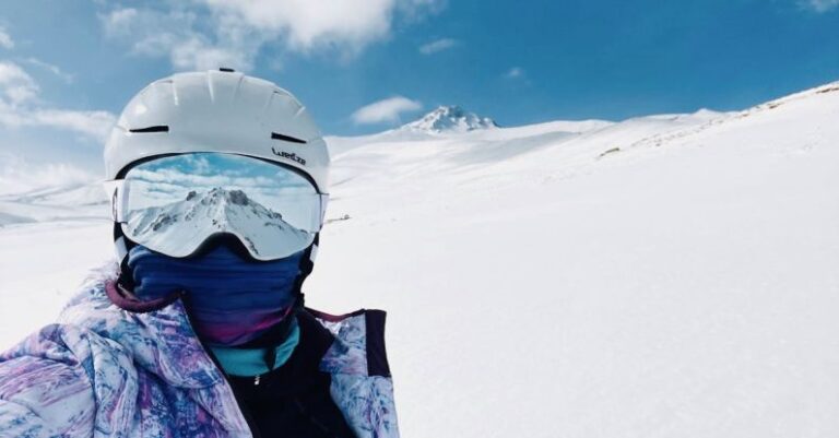 Winter Sport - A person wearing a ski helmet and goggles on a snowy slope